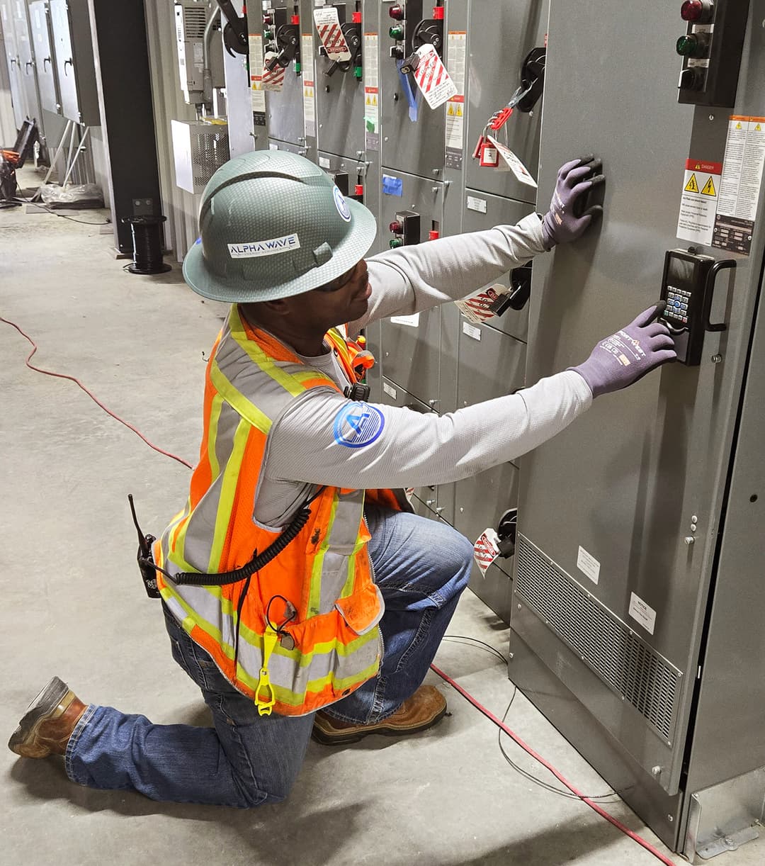 Gerard, Alpha Wave field commissioning lead, inspecting instrumentation